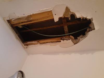 Ceiling collapse from prolonged roof leak showing water damage — Broward County FL