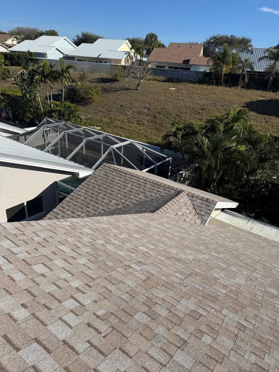 Asphalt shingle roof replacement with screen enclosure in Coconut Creek, FL — Broward Roofing Pros