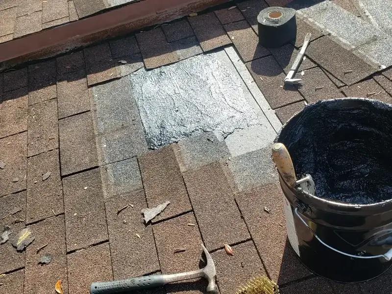 Roof repair in progress on asphalt shingles in Miramar, FL — Broward Roofing Pros