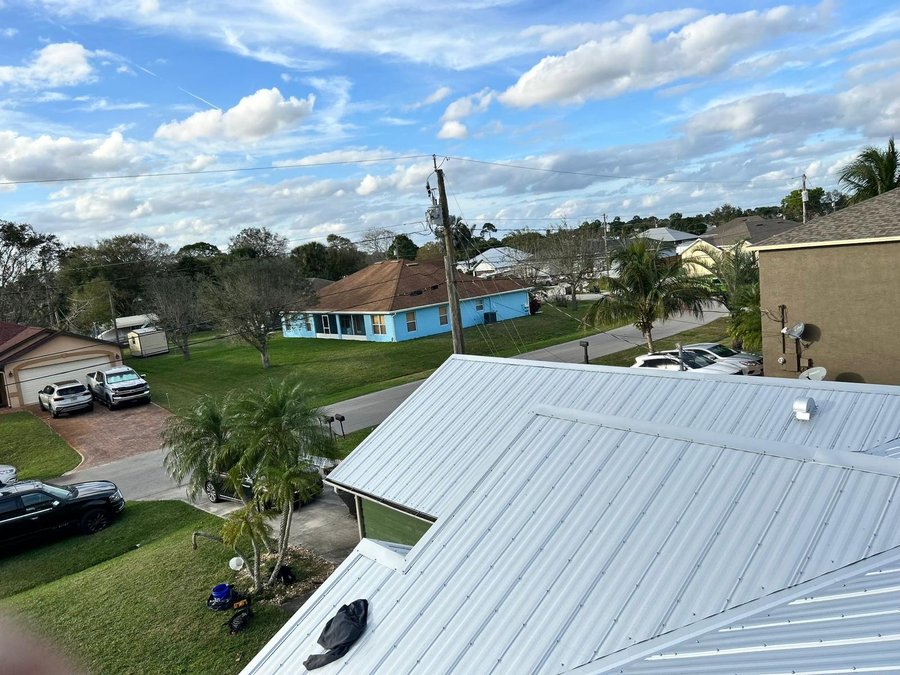 White standing seam metal roof installation in North Lauderdale, FL — Broward Roofing Pros