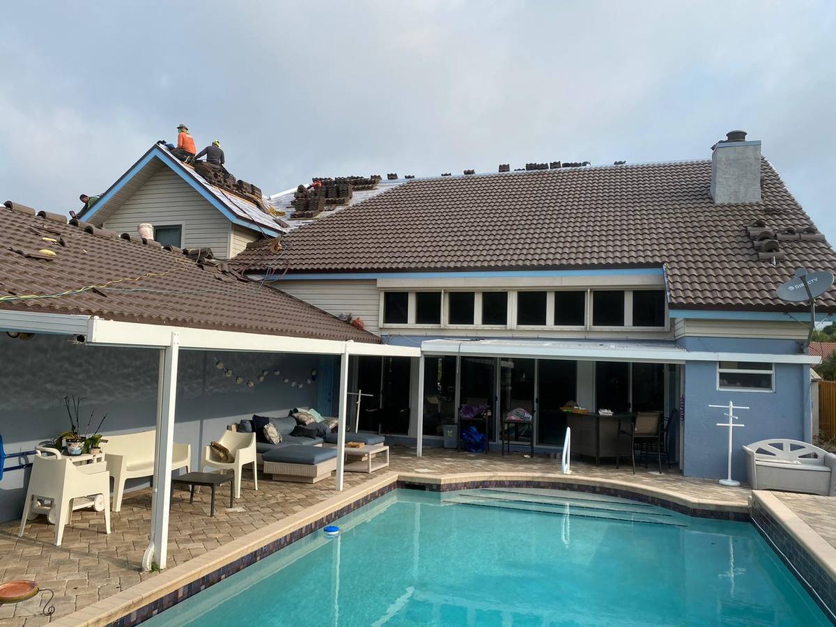 Full crew tile roof replacement in Pompano Beach, FL — Broward Roofing Pros